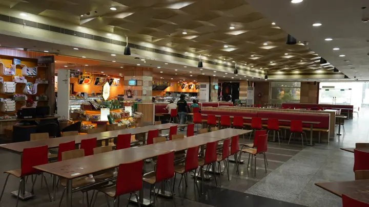 Food court seating with long communal tables at MSX Mall, Greater Noida