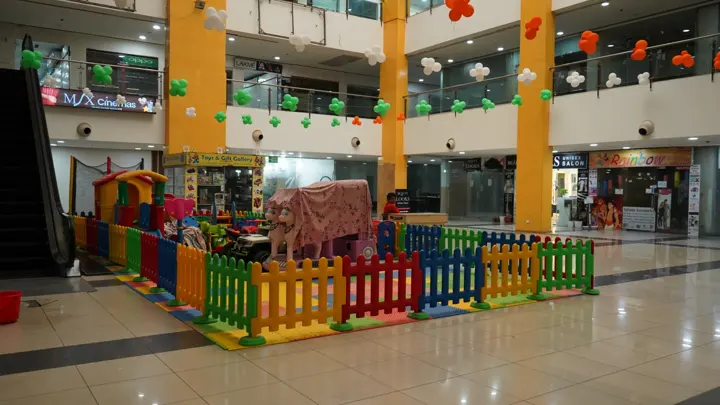 Central atrium with escalators and the children's play zone at MSX Mall, Greater Noida