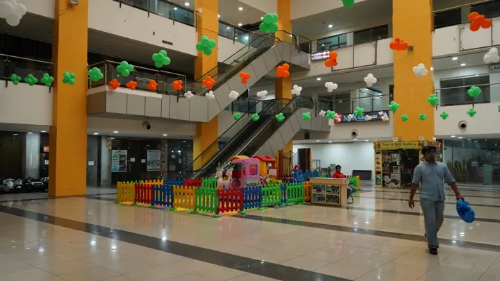 Central atrium with escalators and the children's play zone at MSX Mall, Greater Noida