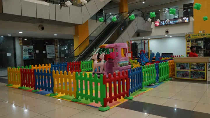 Central atrium with escalators and the children's play zone at MSX Mall, Greater Noida